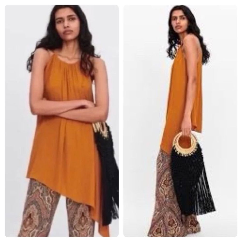 Burnt orange asymmetrical hem suspended neck top size small
